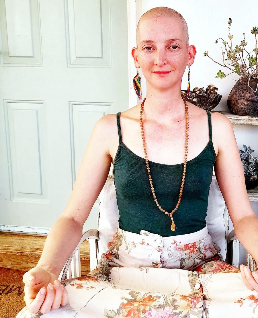 Maya Nassi in quiet meditation in a garden
