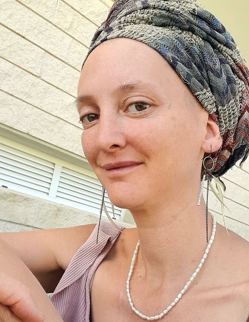 Maya Nassi, smiling warmly